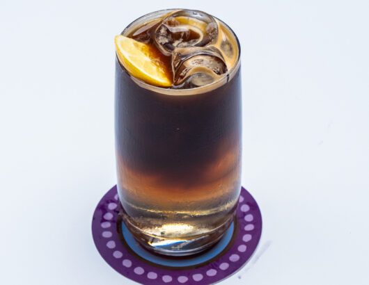 A perfect summer drink: iced coffee with a lemon twist