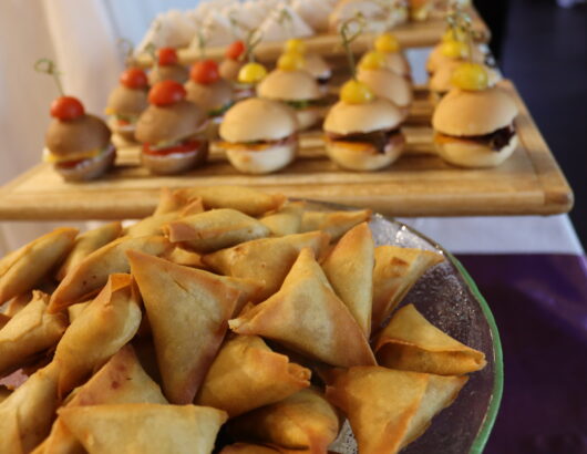 A mouthwatering display of delicious finger foods, ready to be enjoyed.